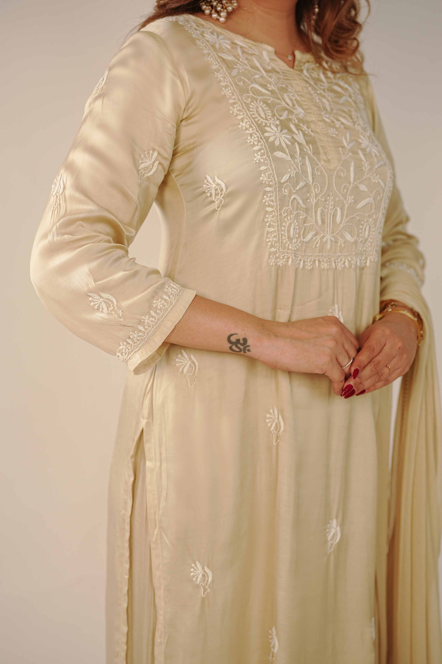 A classic pure modal satin set featuring timeless Lucknowi chikankari embroidery.
A testament to the enduring beauty and skilled craftsmanship found in every Art of Awadh festive ensemble.