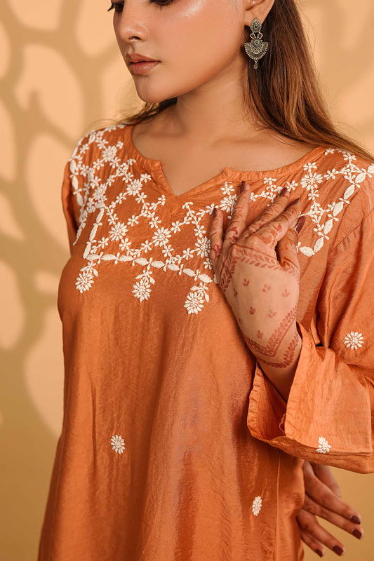Timeless rust-colored linen kurta set showcasing intricate Art of Awadh chikankari craft.
A sophisticated ethnic ensemble designed for professional office environments and everyday use.