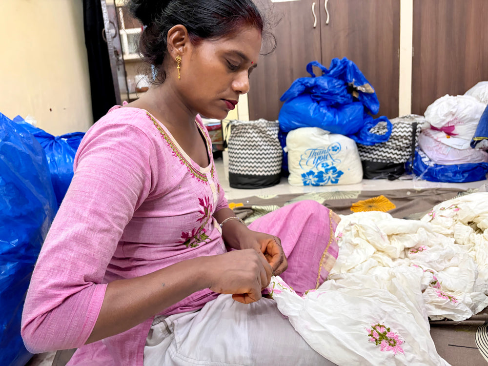 An artisan applying the final, graceful touches to a hand-embroidered piece from the Art of Awadh collection.