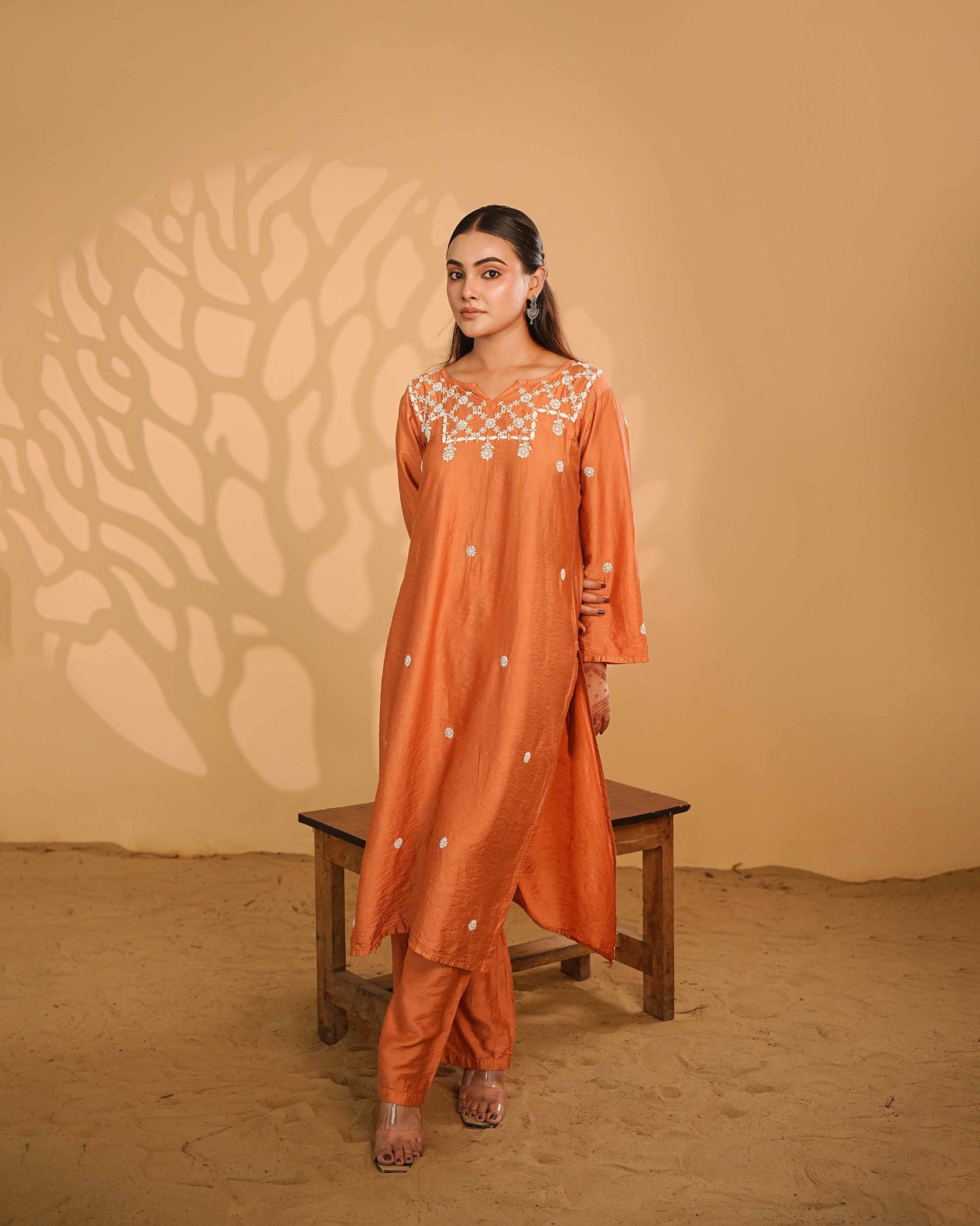 Graceful rust linen chanderi set featuring delicate white floral Lucknowi chikankari detailing.
Elevate your everyday office wardrobe with the unique charm of Art of Awadh craftsmanship.
