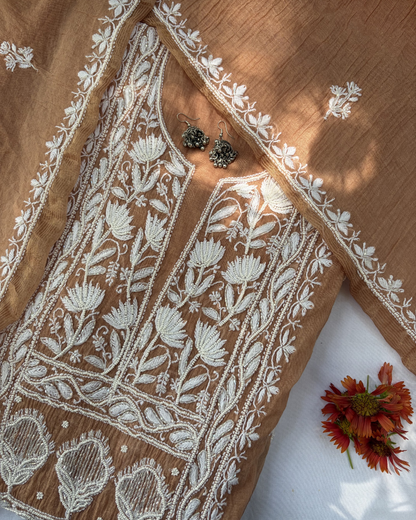 Elegant Bronze colour mul chanderi ensemble showcasing Lucknowi chikankari art of awadh for celebrations.