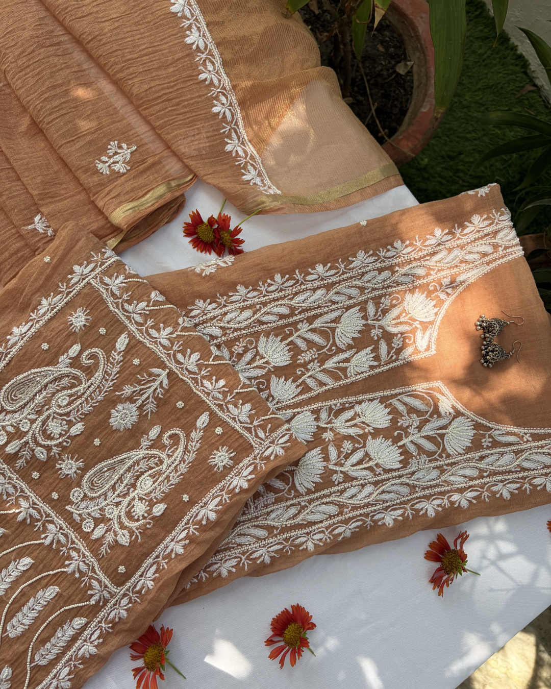 Fine Lucknowi chikankari art of awadh crafted on a Bronze colourt mul chanderi fabric base.