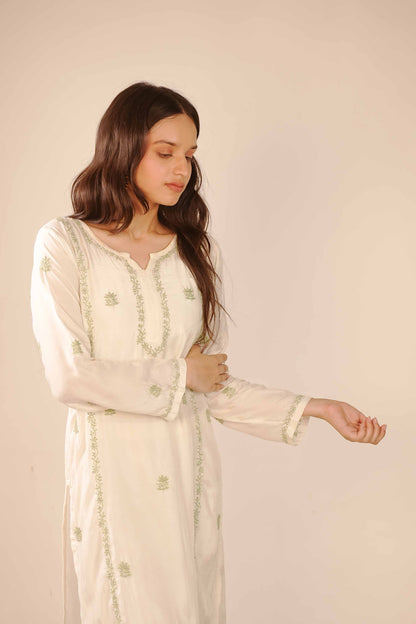 Elegant ivory co-ord set featuring delicate Lucknowi chikankari embroidery.
A sophisticated choice from the Art of Awadh, perfect for both professional office and college wear.

