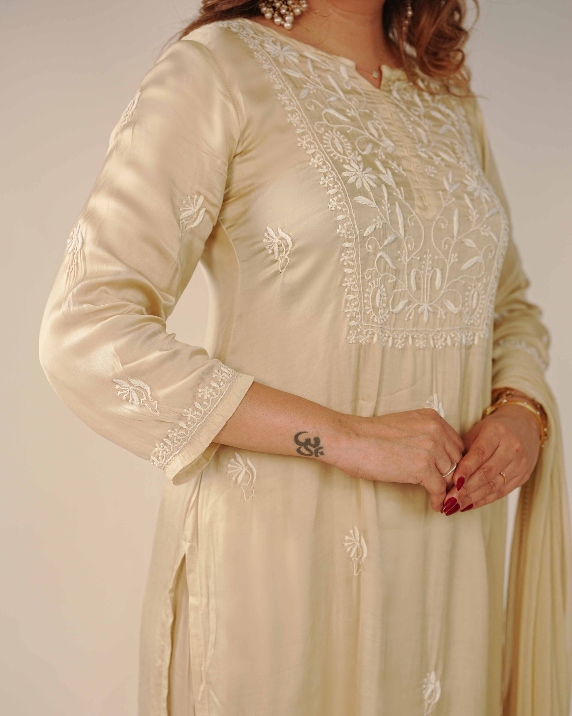 Luxurious pure modal satin set featuring intricate Lucknowi chikankari embroidery.
A sophisticated ensemble from the Art of Awadh, perfect for festive celebrations and intimate get-togethers.
