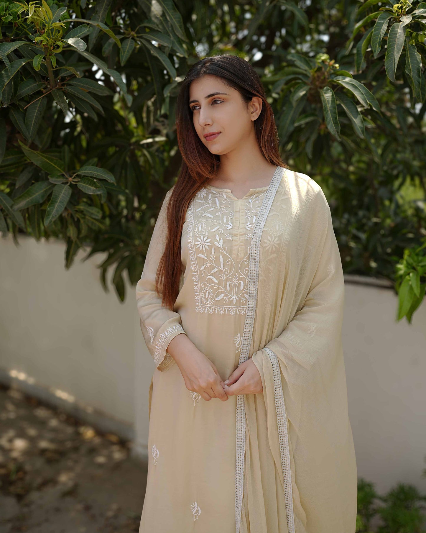Luxurious pure modal satin set featuring intricate Lucknowi chikankari embroidery.
A sophisticated ensemble from the Art of Awadh, perfect for festive celebrations and intimate get-togethers.

