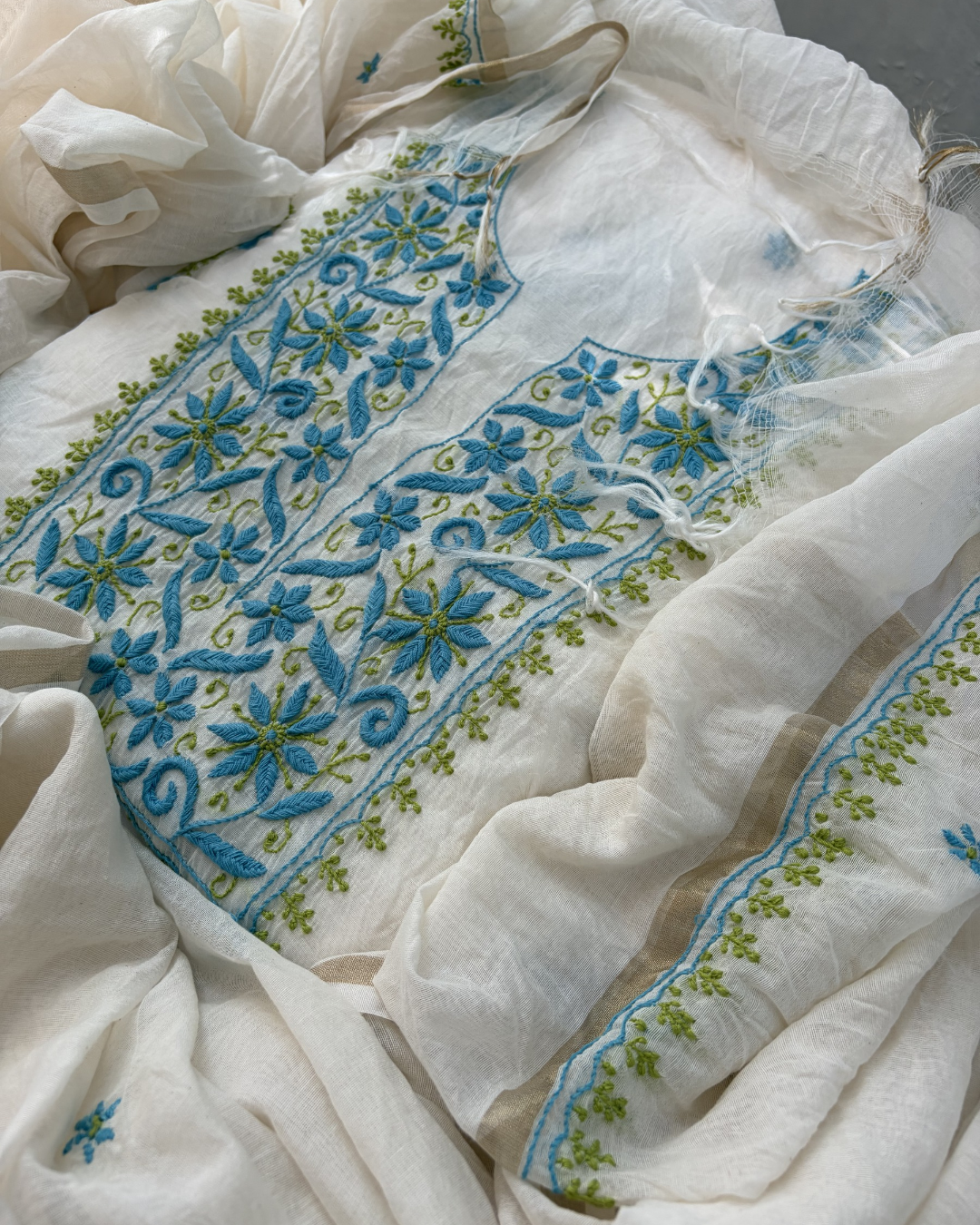 Floral hand-embroidered mul chanderi unstitched fabric.
Lucknowi chikankari art of awadh for spring festivities.
