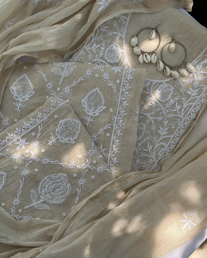 Elegant beige mul chanderi ensemble showcasing Lucknowi chikankari art of awadh for celebrations.
