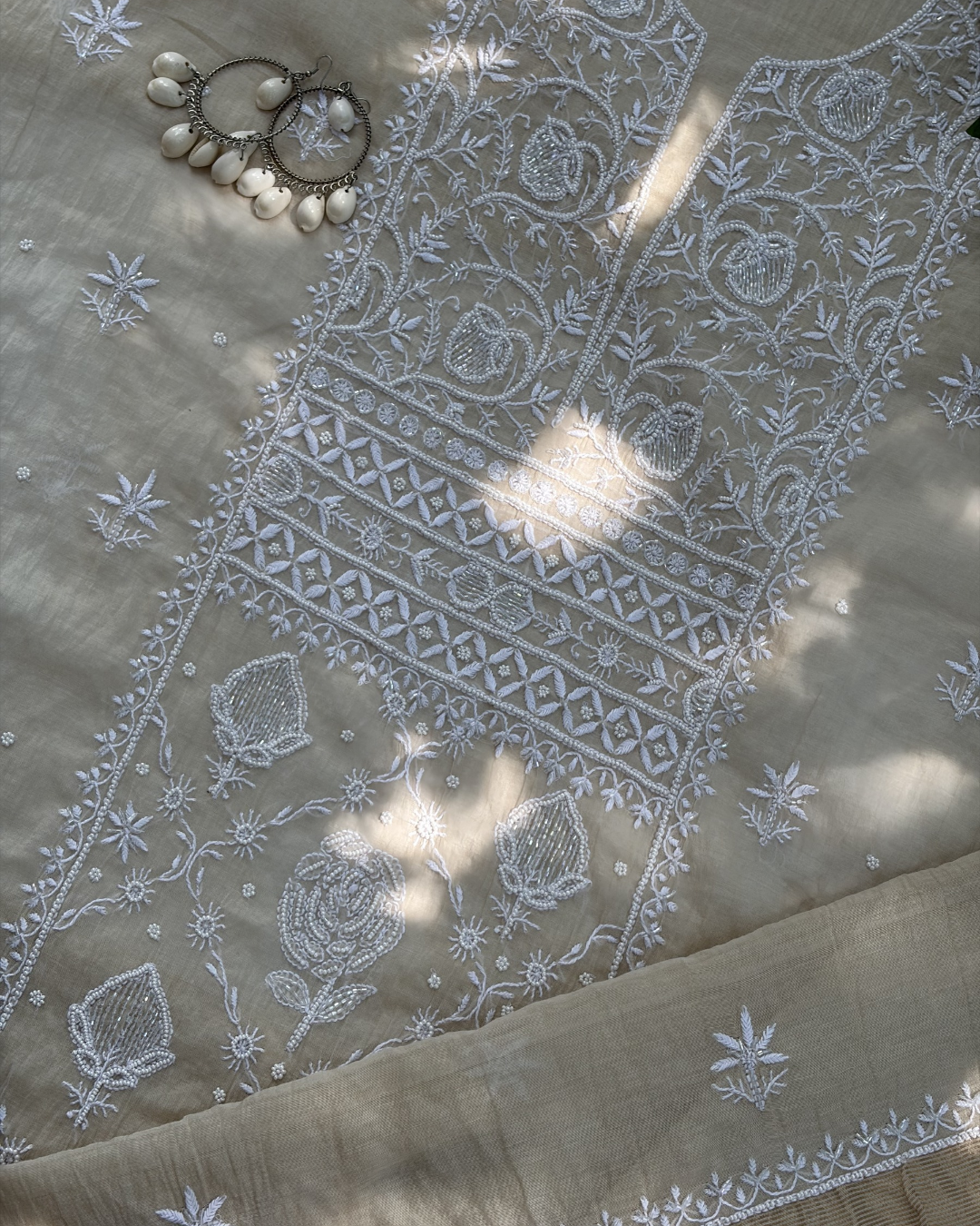 Fine Lucknowi chikankari art of awadh crafted on a beige mul chanderi fabric base.