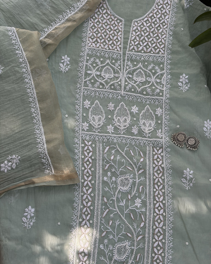 Elegant pastel green mul chanderi ensemble showcasing Lucknowi chikankari art of awadh for celebrations.