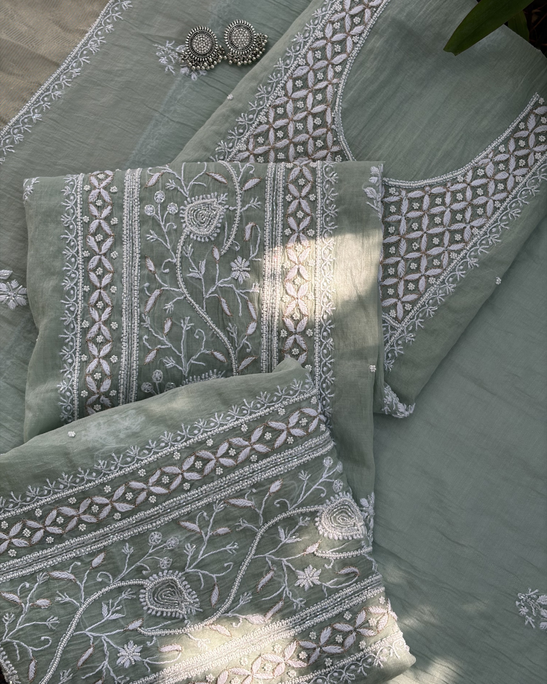 Traditional Lucknowi chikankari art of awadh on pastel green mul chanderi fabric for daytime events.