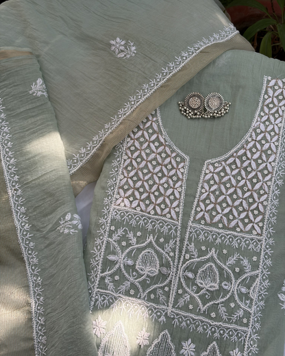 Intricate Lucknowi chikankari art of awadh displayed on a pastel green mul chanderi garment.