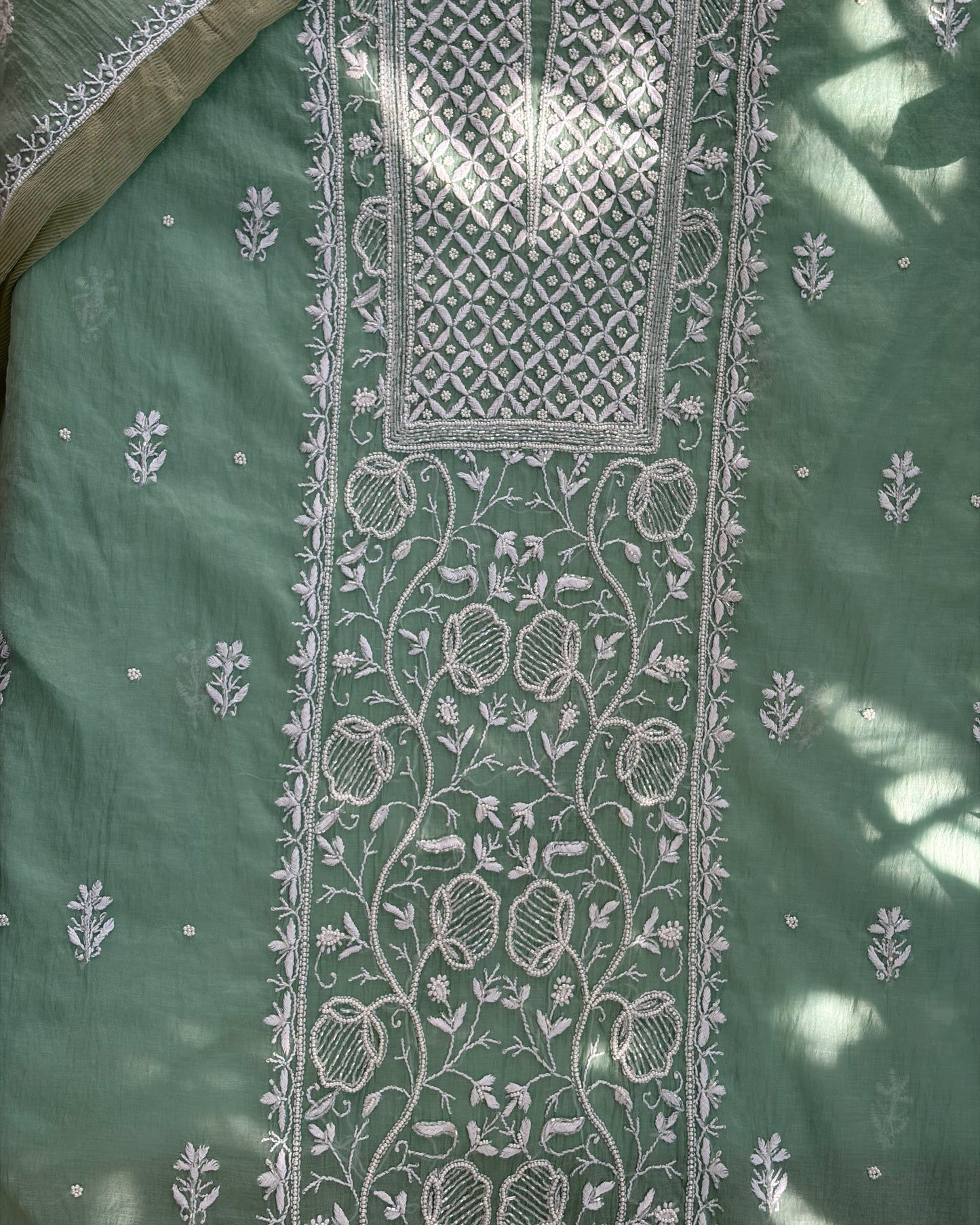 Classic Lucknowi chikankari art of awadh in pistachio green mul chanderi for cultural gatherings.