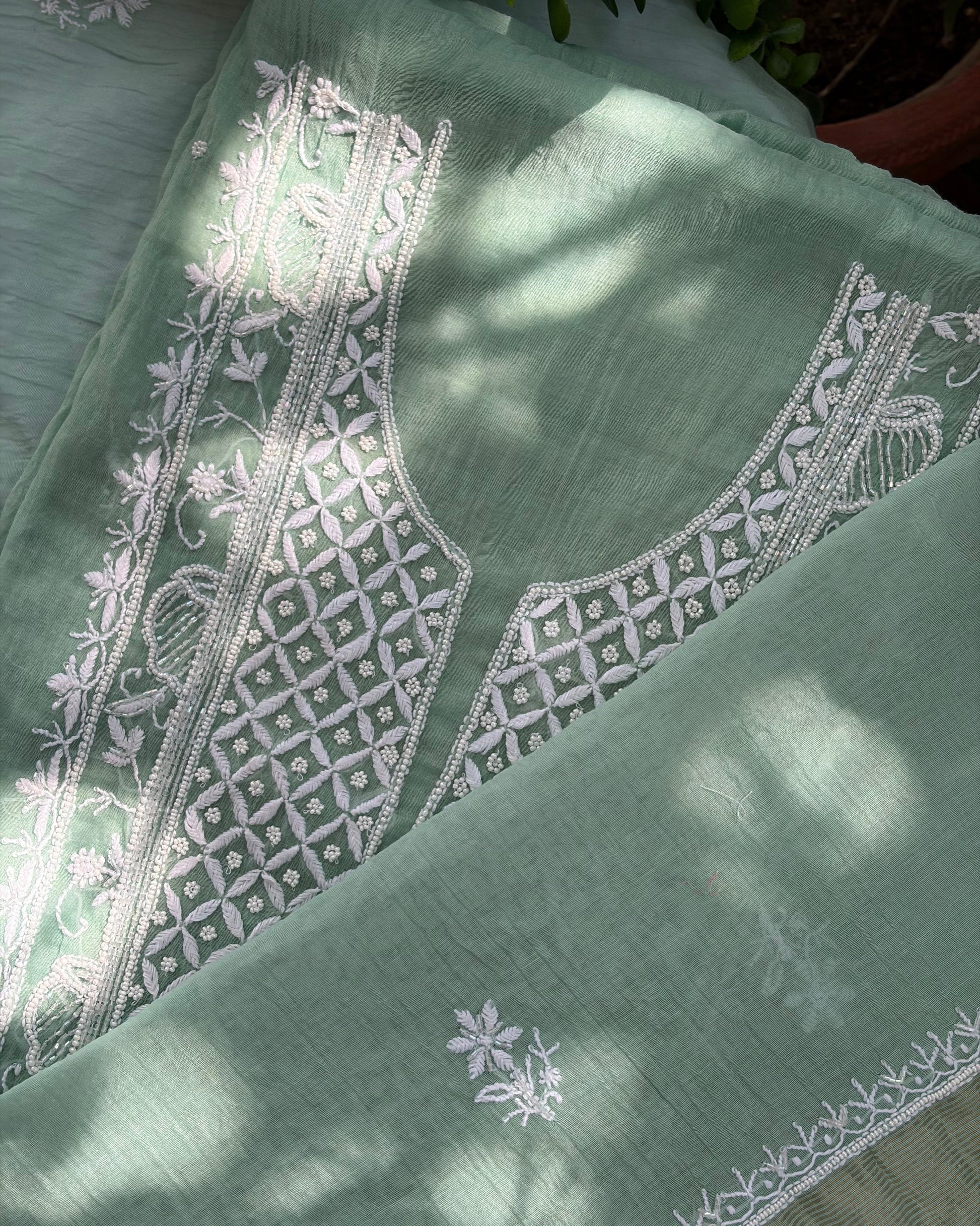 Fine Lucknowi chikankari art of awadh crafted on a pistachio green mul chanderi fabric base.
