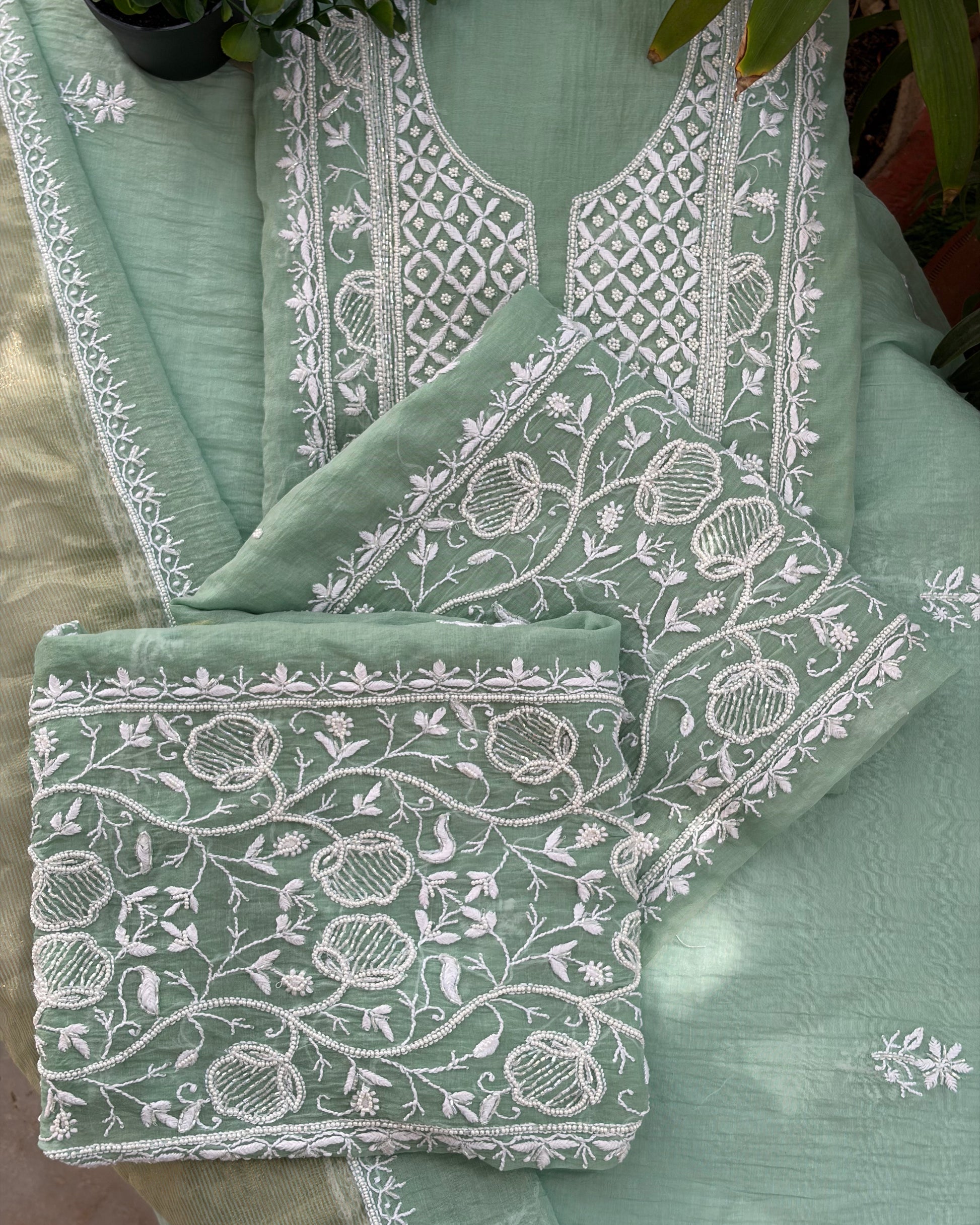 pistachio green mul chanderi set featuring Lucknowi chikankari art of awadh for formal occasions.