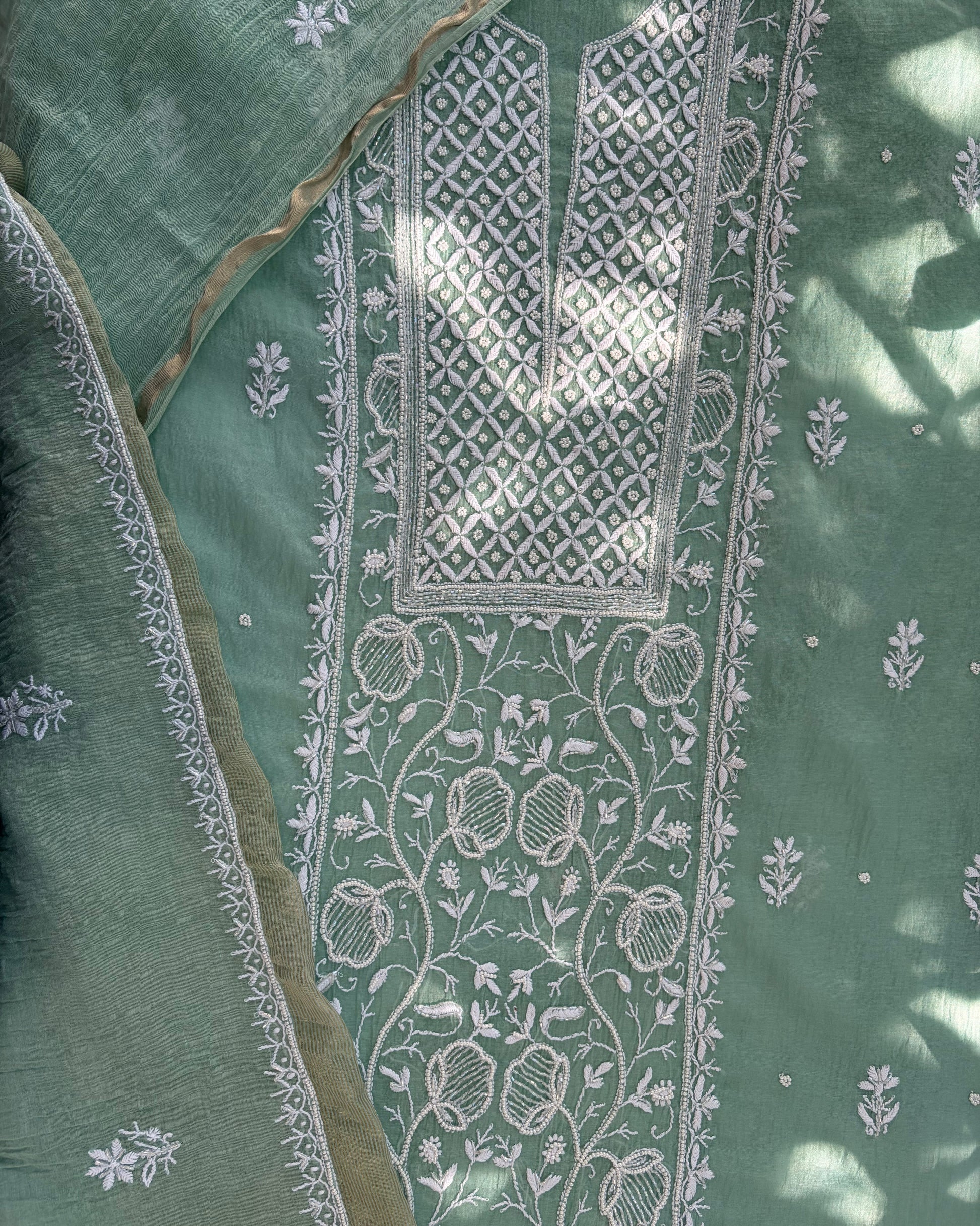 Traditional Lucknowi chikankari art of awadh on mint mul chanderi fabric for day events.