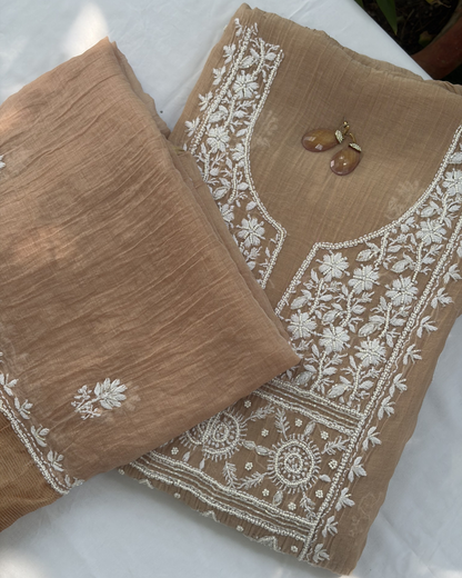 Elegant rose blush mul chanderi ensemble showcasing Lucknowi chikankari art of awadh for celebrations.