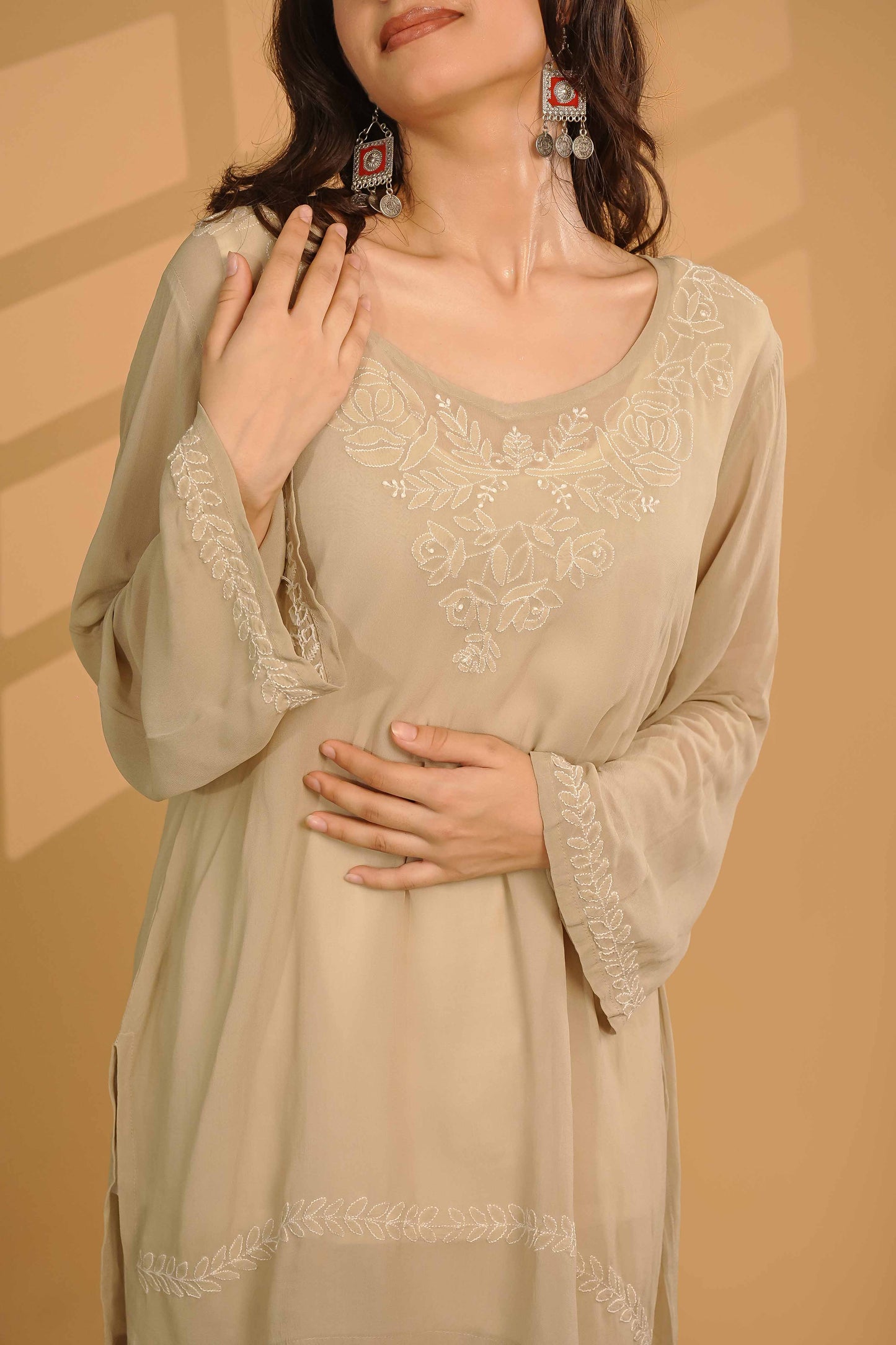 Masterfully crafted viscose georgette kurti showcasing detailed Lucknowi chikankari patterns.
Celebrate the heritage of fine needlework in soft georgette, brought to you by Art of Awadh.
