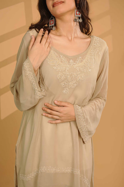 Masterfully crafted viscose georgette kurti showcasing detailed Lucknowi chikankari patterns.
Celebrate the heritage of fine needlework in soft georgette, brought to you by Art of Awadh.
