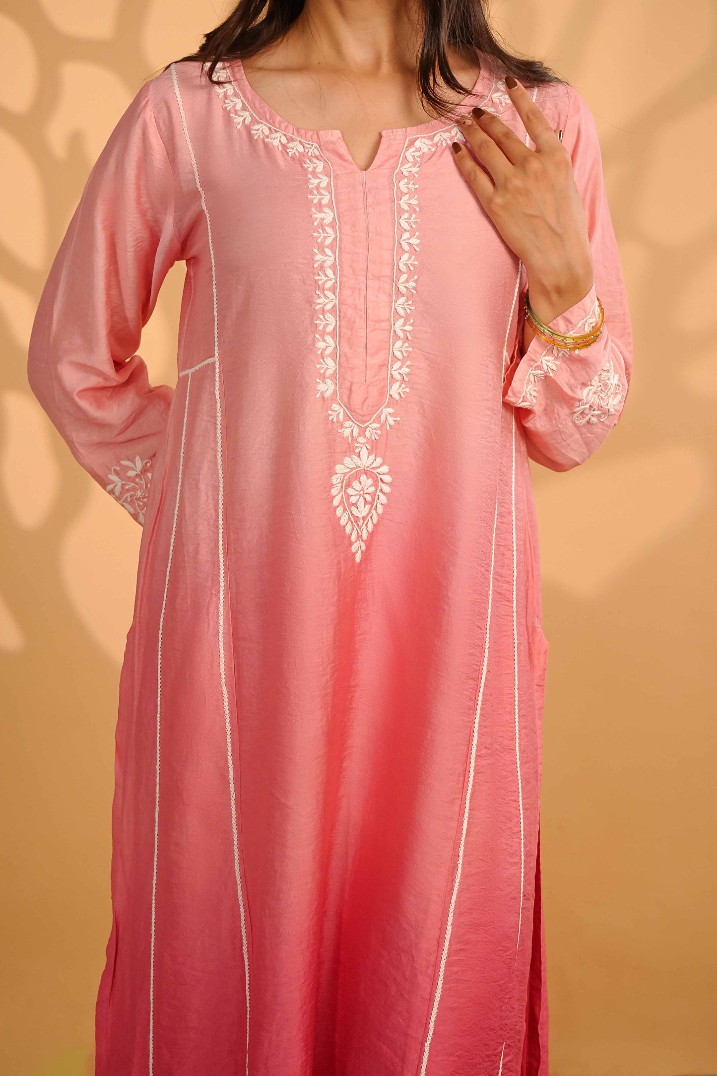 Breathable pink linen chanderi set showcasing detailed Lucknowi chikankari craftsmanship.
Experience the comfort and grace of the Art of Awadh during your workday and weekend plans.
