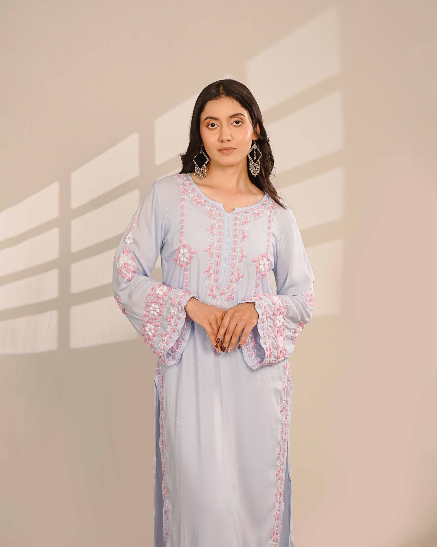 Breathable modal blue co-ord set showcasing detailed Lucknowi chikankari patterns.
Experience heritage Art of Awadh craftsmanship during your workday and weekend day outs.
