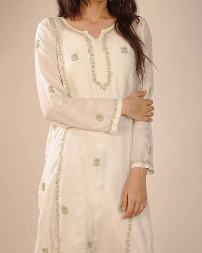 Minimalist ivory co-ord set featuring subtle Lucknowi chikankari detailing.
Authentic Art of Awadh apparel designed for a refined and sophisticated college-ready look.
