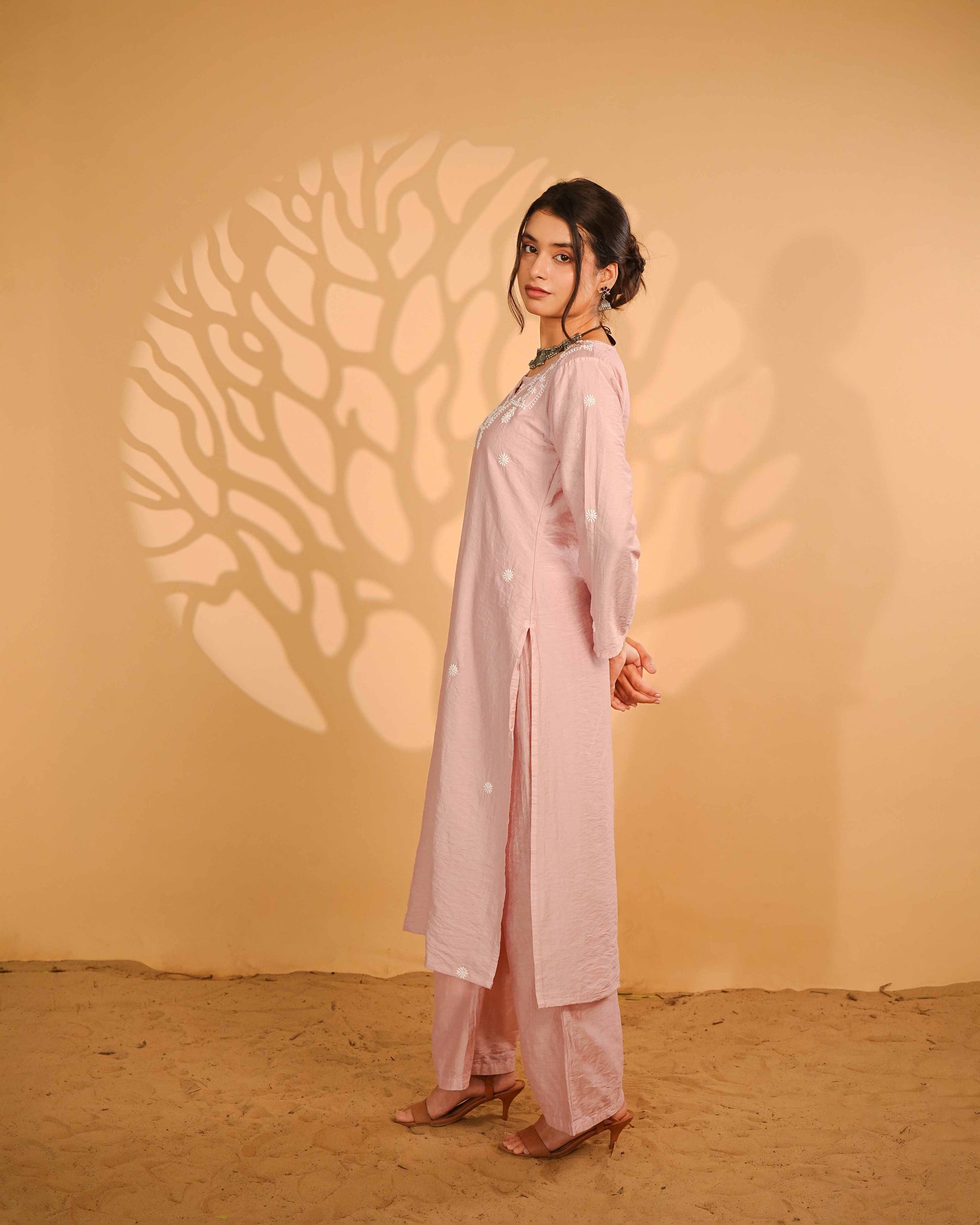 Minimalist linen chanderi set featuring subtle Lucknowi chikankari detailing.
Authentic Art of Awadh apparel designed for refined daily wear and effortless small party styling.
