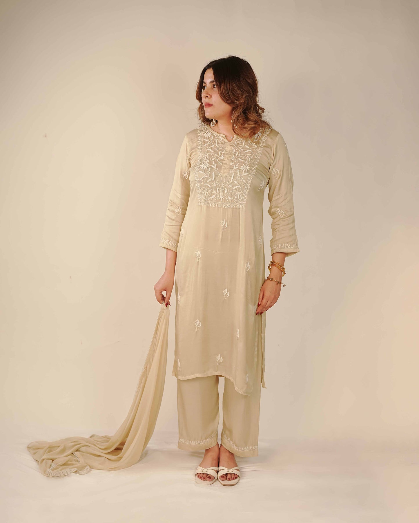 Timeless pure modal satin set adorned with authentic Lucknowi chikankari artistry.
Elevate your festive look with this premium, elegant piece from the Art of Awadh collection.
