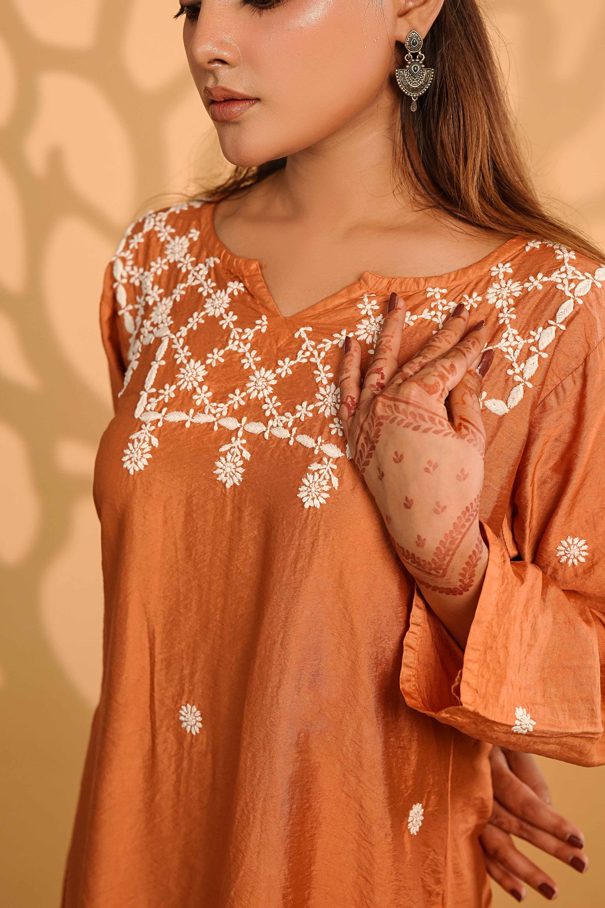 Timeless rust-colored linen kurta set showcasing intricate Art of Awadh chikankari craft.
A sophisticated ethnic ensemble designed for professional office environments and everyday use.
