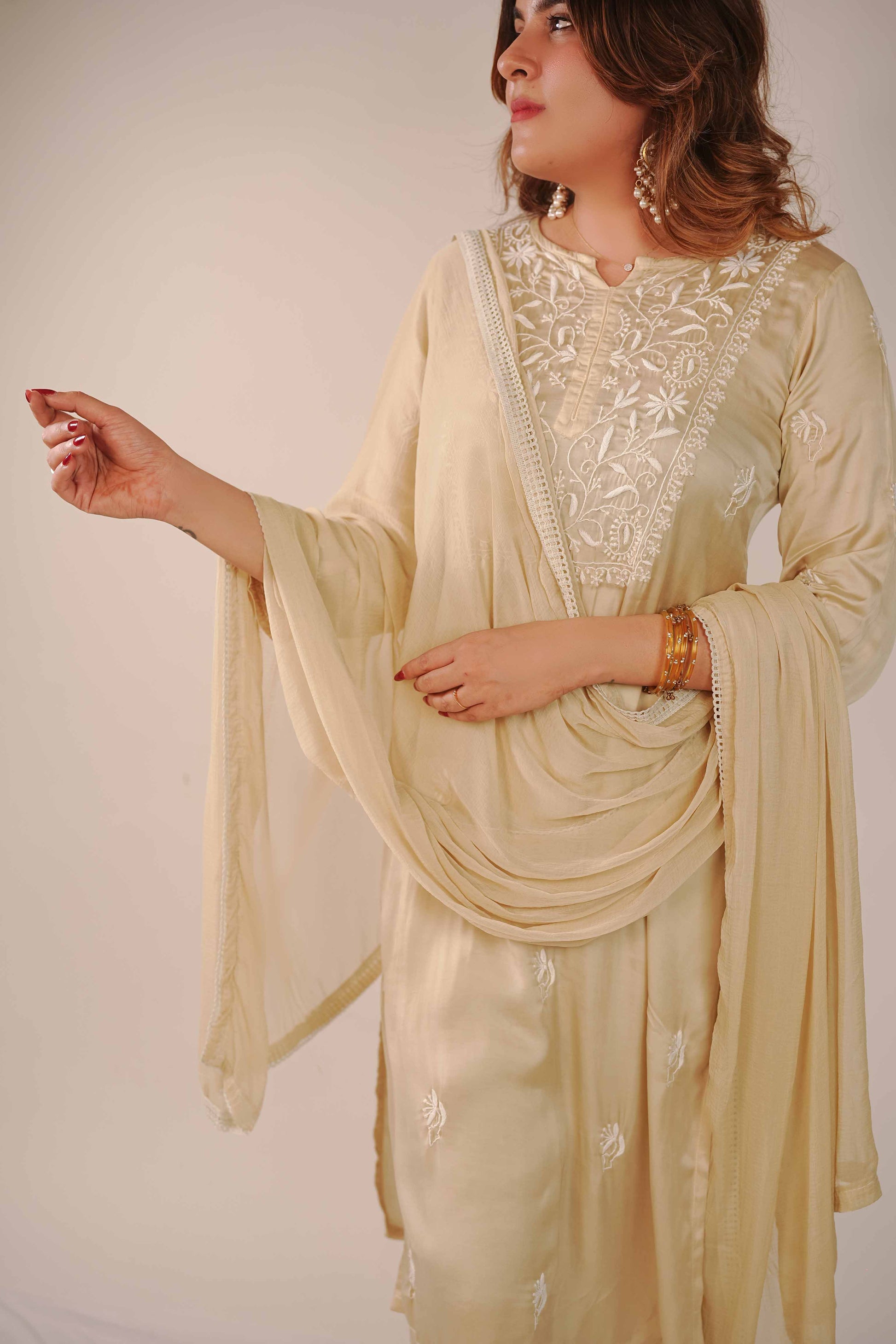Minimalist pure modal satin set featuring elegant Lucknowi chikankari detailing.
Authentic Art of Awadh apparel designed for a refined and sophisticated presence at festivals and get-togethers.

