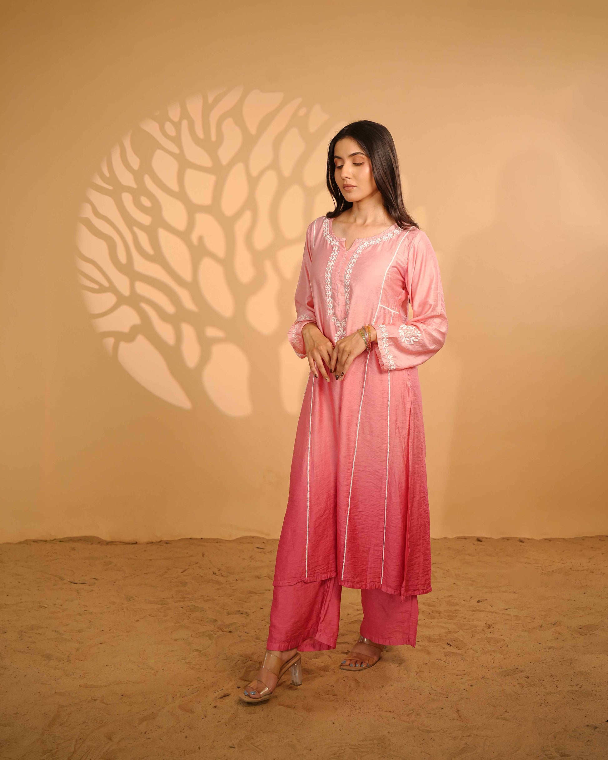 Minimalist pink linen chanderi set featuring authentic Lucknowi chikankari detailing.
Authentic Art of Awadh apparel designed for refined daily office wear and effortless styling.
