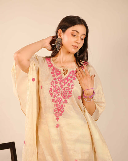 Minimalist tissue co-ord set featuring soft-toned Lucknowi chikankari detailing.
Authentic Art of Awadh apparel designed for a refined and sophisticated day party look.
