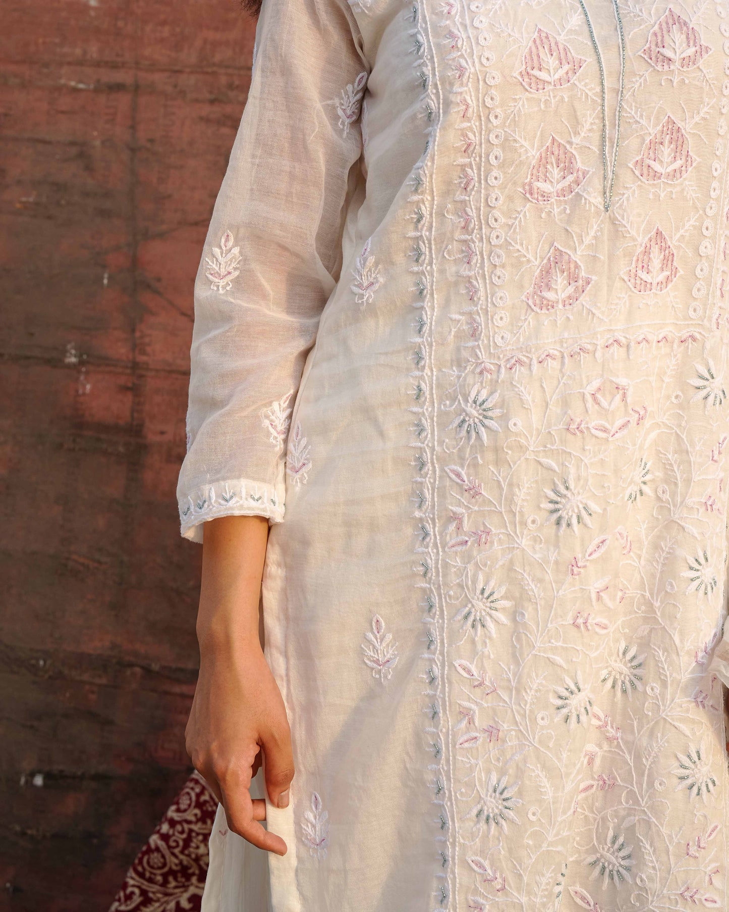 Authentic white chikankari suit in premium Mul Chanderi by Art of Awadh.
Beautifully crafted to ensure you shine at every evening party and traditional event.
