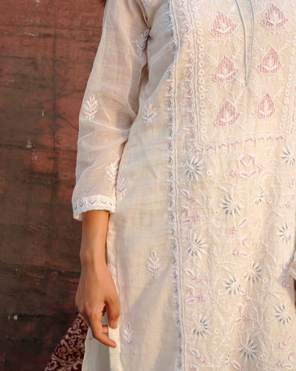 Authentic white chikankari suit in premium Mul Chanderi by Art of Awadh.
Beautifully crafted to ensure you shine at every evening party and traditional event.
