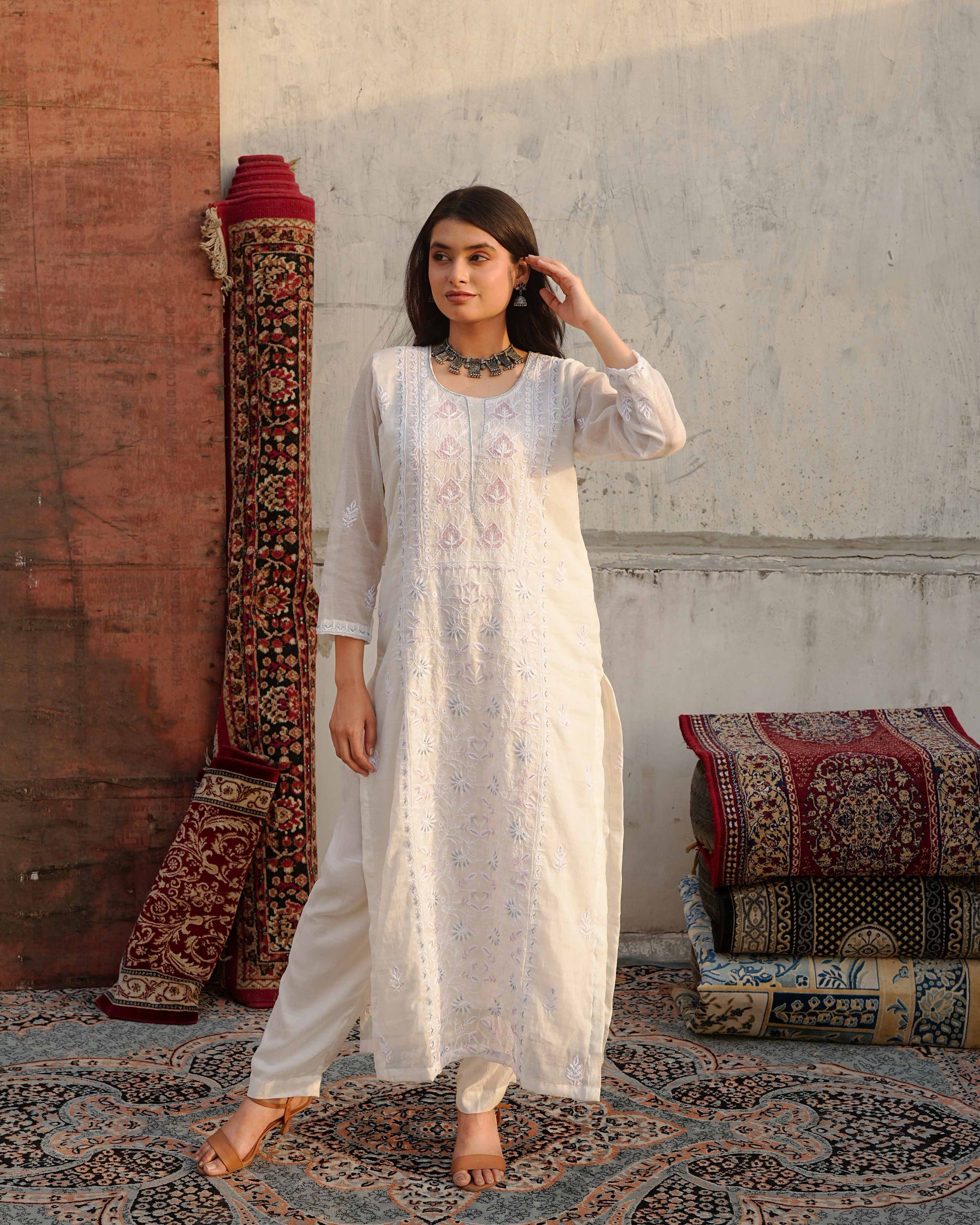  Minimalist white Mul Chanderi suit highlighting heritage Lucknowi chikankari craftsmanship.
A stunning Art of Awadh piece, perfect for evening gatherings and traditional celebrations.
